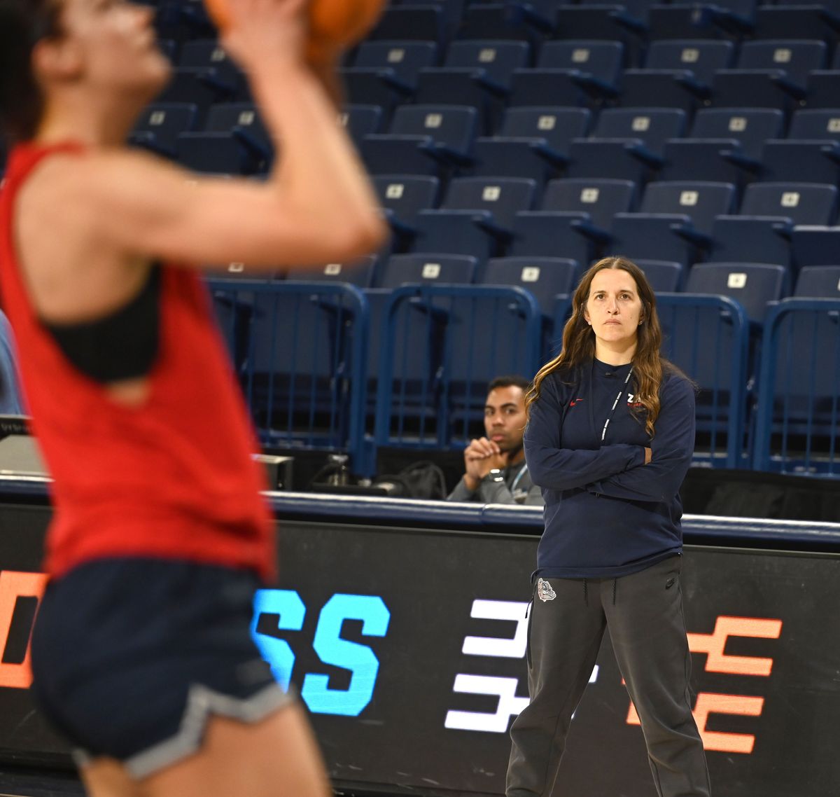 Gonzaga head coach Lisa Fortier watches as her team warms up Friday ahead of Saturday’s NCAA Tournament opening-round game at McCarthey Athletic Center.  (Jesse Tinsley/THE SPOKESMAN-REVI)
