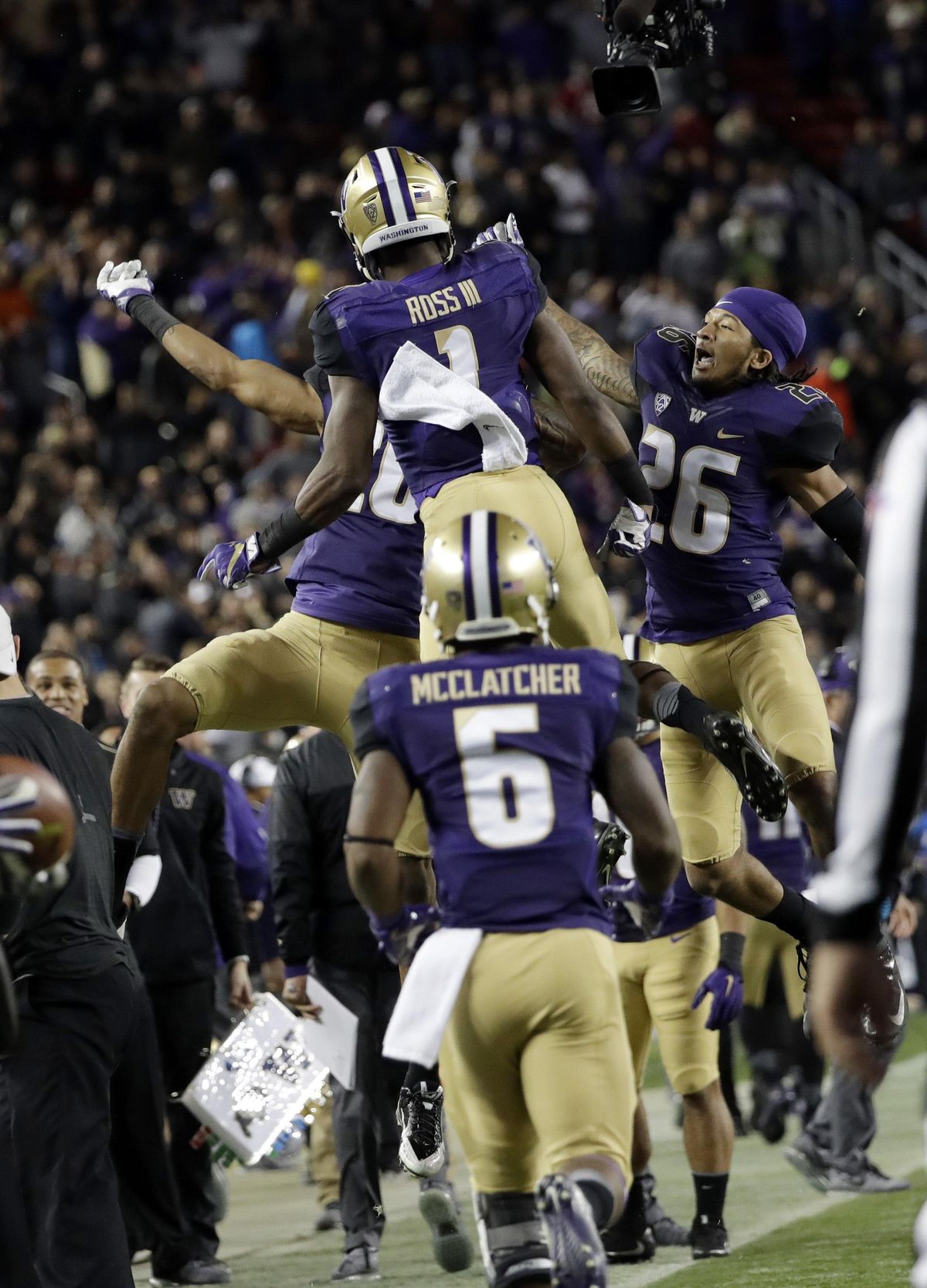 Washington wide receiver John Ross (1) celebrates his touchdown catch with teammates, including Sidney Jones (26) and Chico McClatcher (6), during the second half of the Pac-12 Conference championship NCAA college football game against Colorado Friday, Dec. 2, 2016, in Santa Clara, Calif. (Marcio Jose Sanchez / Associated Press)