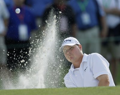 First-round leader Chad Campbell blasts out of a bunker on the 18th hole at the Masters at Augusta, Ga.  (Associated Press / The Spokesman-Review)