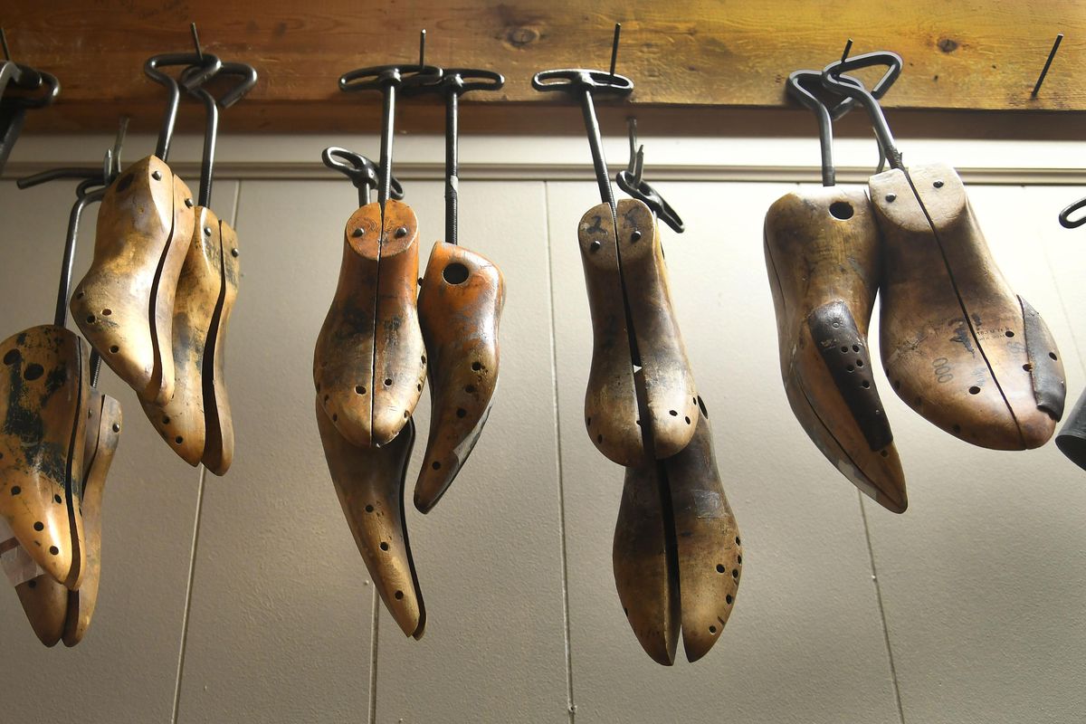 Shoe stretchers hang in a back room at Ressa’s Shoe Service at 20 E. Indiana Ave. in Spokane. (Dan Pelle / The Spokesman-Review)