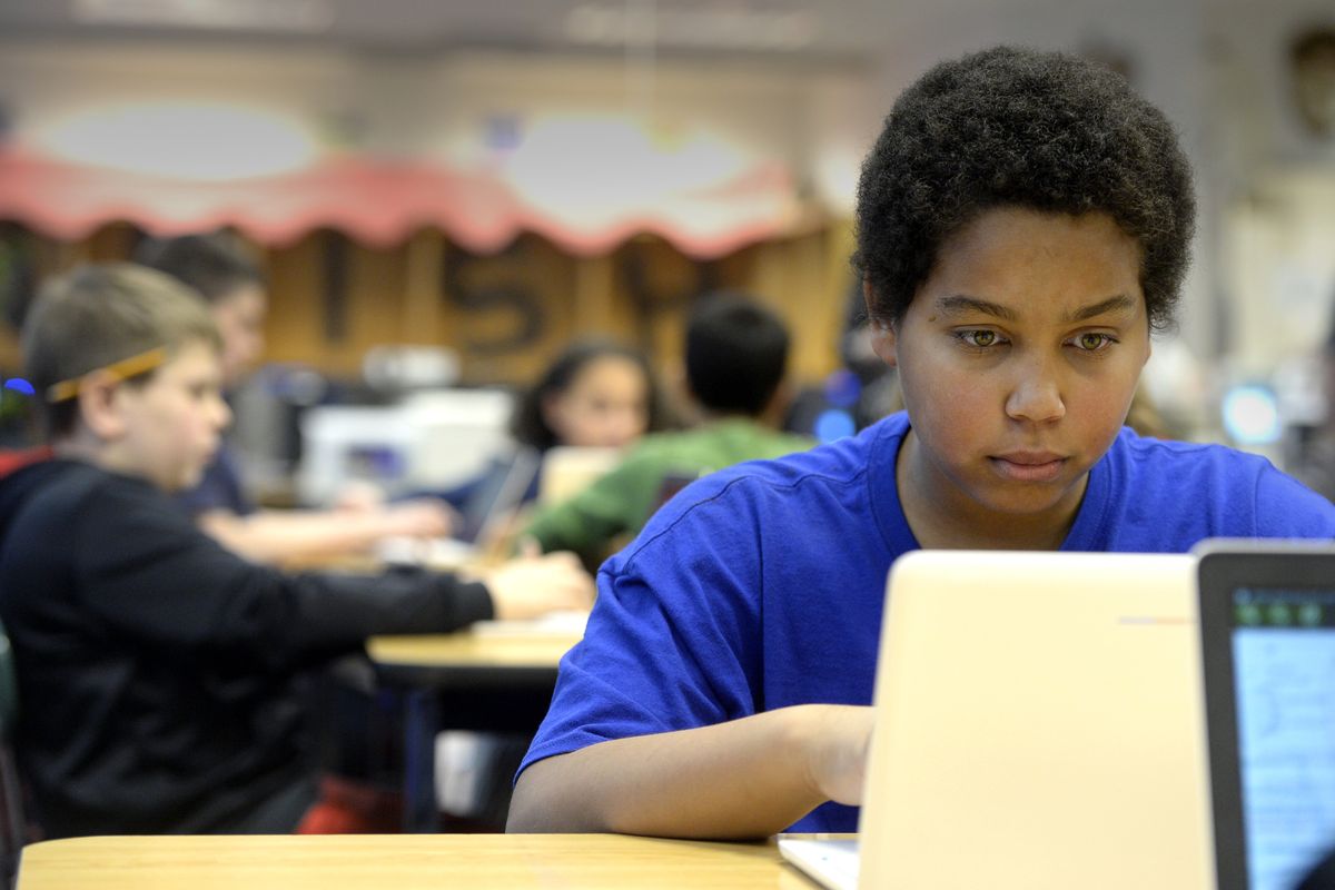 Quinten Little, 13, uses a Wi-Fi-connected laptop to take a practice test at Bowdish Middle School on Tuesday. The Wi-Fi is a new feature at CV schools. Schools also got new devices. Bowdish got Google Chrome books. (Jesse Tinsley)
