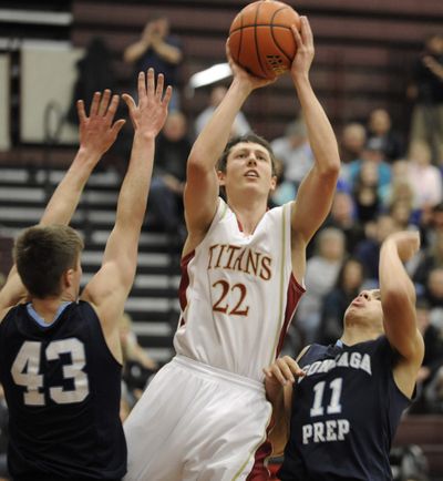 U’Hi’s Brett Bailey lofts a shot between G-Prep’s Jacob Groh, left, and T.J. Bracey. (Christopher Anderson)