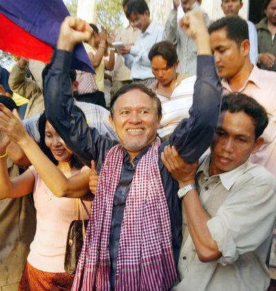 Kem Sokha from the U.S.-funded Cambodian Center for Human Rights celebrates with his supporters outside Prey Sar prison on the outskirts of Phnom Penh, Cambodia, Tuesday, Jan. 17, 2006. (JIMMY BROWN / Associated Press)