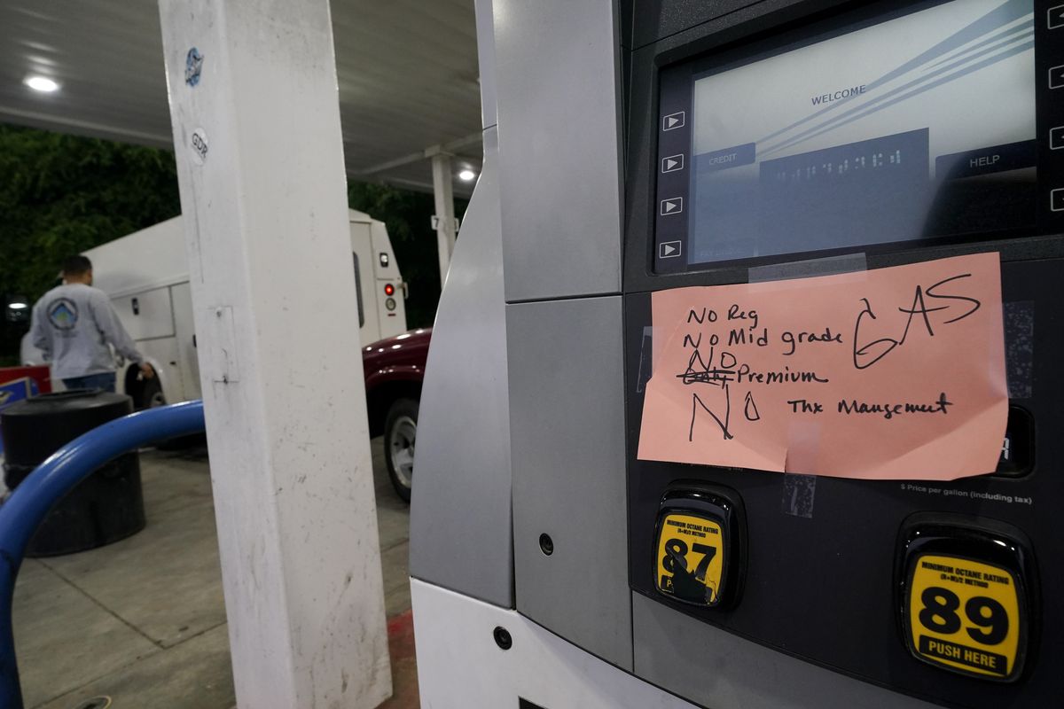 A hand written sign is posted on a gas pump, showing that the service station is out of all grades of fuel Wednesday, May 12, 2021, in Charlotte, N.C. Several gas stations in the Southeast reported running out of fuel, primarily because of what analysts say is unwarranted panic-buying among drivers, as the shutdown of a major pipeline by hackers entered its fifth day.  (Chris Carlson)