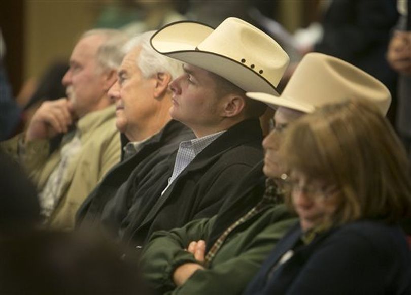 Ryan Finney, from Meridian, center, listens to testimony in the Senate State Affairs Committee on Monday morning (AP/Idaho Statesman / Katherine Jones)