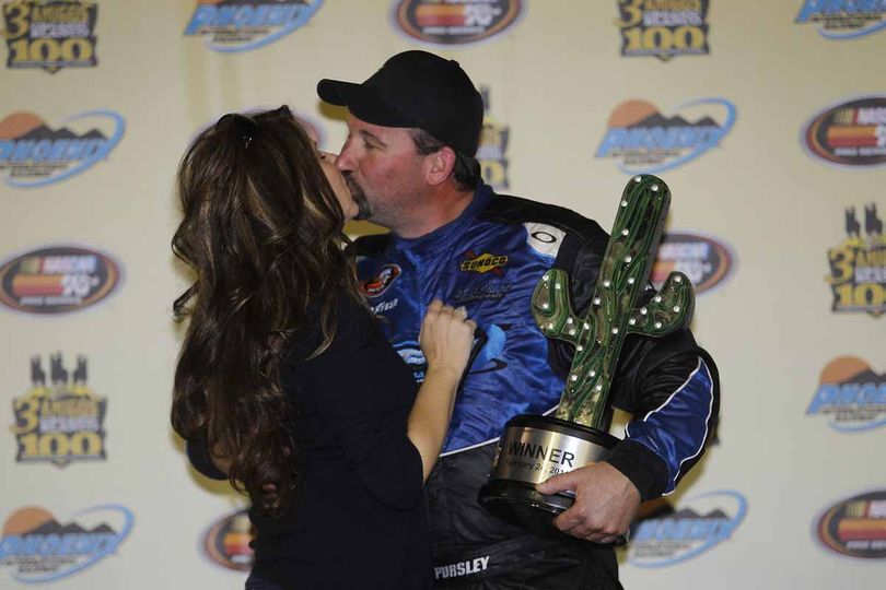 Greg Pursley gets a victory kiss from his wife, Heidi. (Photo Credit: Getty Images for NASCAR) (Todd Warshaw)