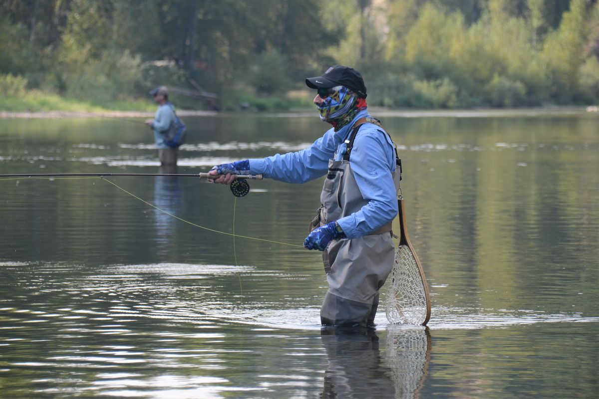 At top: Lee Funkhouser and Father David Kuttner keep their distance while enjoying each other’s company during an unofficial Inland Empire Fly Fishing Club outing for cutthroat trout.  (RICH LANDERS/FOR THE SPOKESMAN-REVIEW)