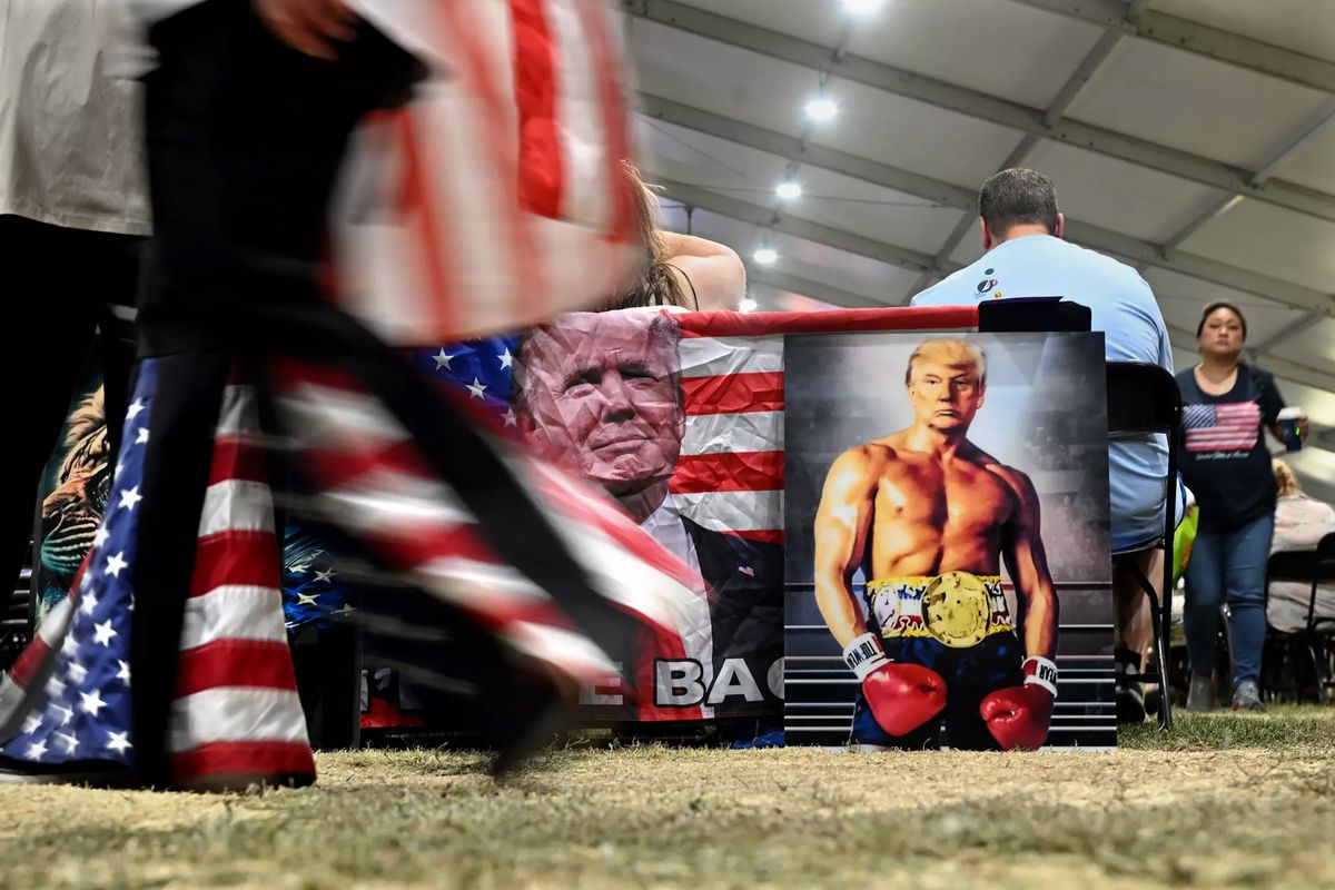 Posters of former President Trump are on sale at the ReAwaken Tour.    (Wally Skalij/Los Angeles Times/TNS)