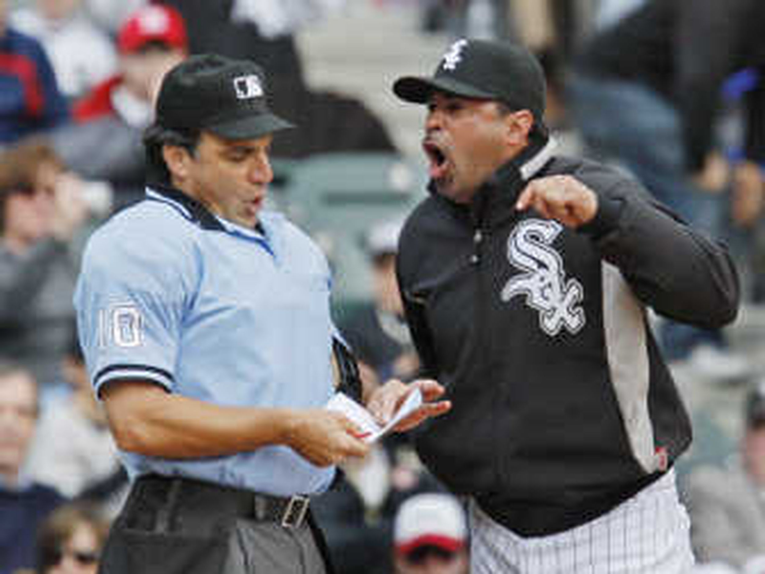 Chicago White Sox manager Ozzie Guillen, left, meets Tampa Bay