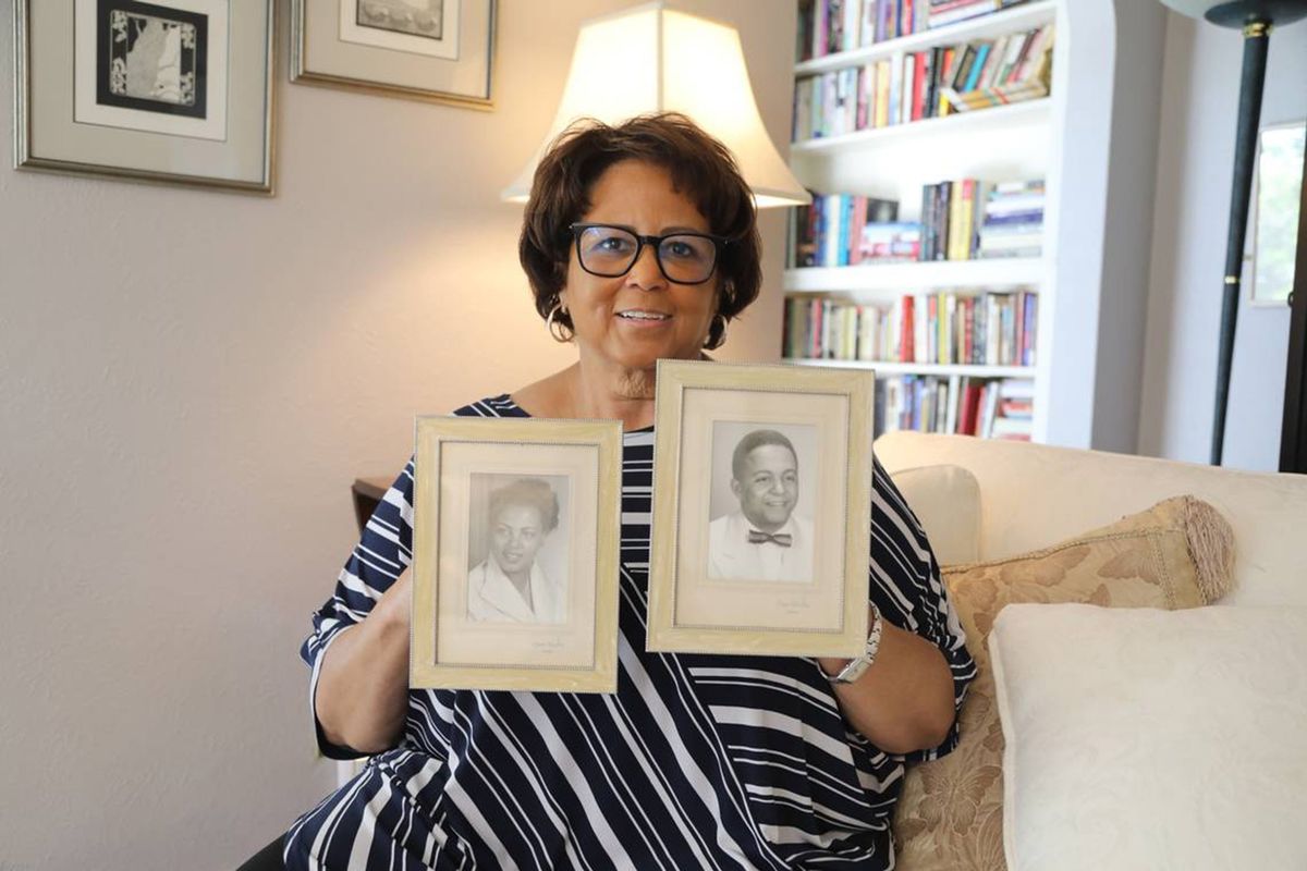 Cherie Buckner-Webb, who still lives in Boise’s North End, holds up photos of her parents, Dorothy and Aurelius Buckner, in her home. Dorothy Buckner was a fierce advocate for civil rights in Idaho.  (Catherine Odom/Idaho Statesman/TNS)