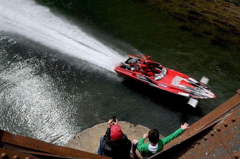 Paul Brebner, left, of St. Maries, and Logan Dianda, of Medical Lake, watch the 2012 World Jet Boat Races from a bridge above the St. Joe River on Sunday. (Kathy Plonka)