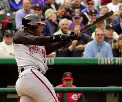 Cincinnati Reds’ Ken Griffey Jr., follows through as he hits a solo home run off Colorado Rockies pitcher Rolando Arrojo in the fourth inning of their game at Coors Field in Denver on Monday, April 10, 2000. Griffey Jr. became the youngest player to hit 400 major league home runs. (Ed Andrieski / Associated Press)