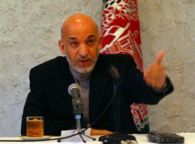 
Afghan President Hamid Karzai, seen here on May 14, ordered an inquiry Tuesday into the U.S. bombing Sunday of a village that killed at least 16 civilians, including some at a religious school.
 (Associated Press / The Spokesman-Review)