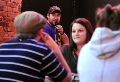 Trivia players listen as emcee Chuck Zeller, above, reads questions on a recent Friday at Eagle’s Pub in Cheney. The popular trivia quizzes are concocted by Zeller, whose games last for several rounds on Tuesday and Friday nights.  (Jesse Tinsley / The Spokesman-Review)