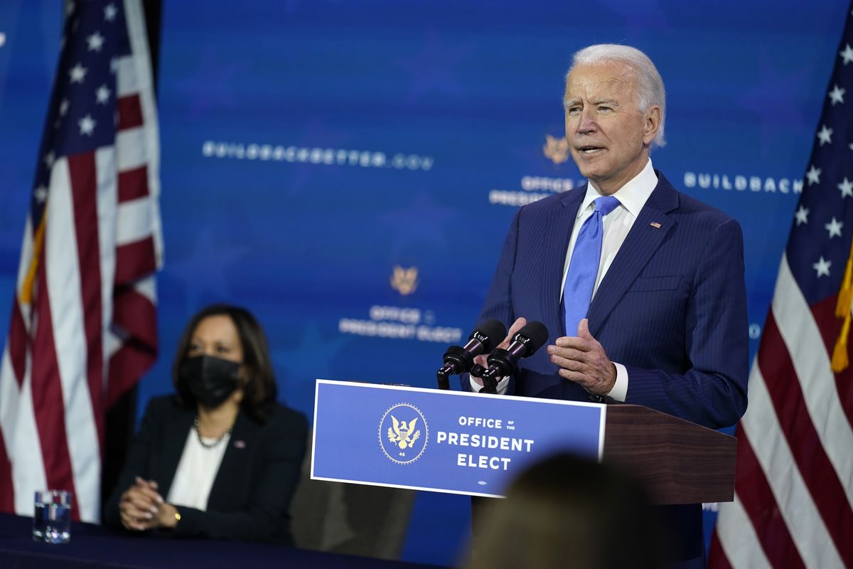 President-elect Joe Biden speaks as Vice President-elect Kamala Harris listens at left, during an event to introduce their nominees and appointees to economic policy posts at The Queen theater, Tuesday, Dec. 1, 2020, in Wilmington, Del. (Andrew Harnik)