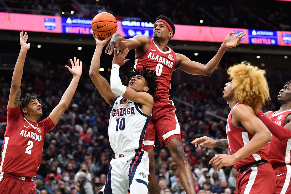 Gonzaga Bulldogs guard Hunter Sallis (10) shoots under pressure from Alabama Crimson Tide forward Noah Gurley (0) during the first half of a college basketball game on Saturday, Dec 4, 2021, at Climate Pledge Arena in Seattle, Wash.  (Tyler Tjomsland / The Spokesman-Review)