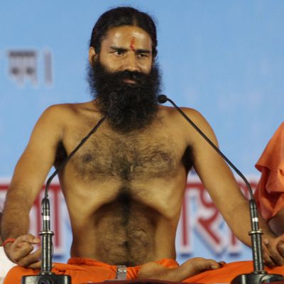 Baba Ramdev does yoga before the strike. (Associated Press)