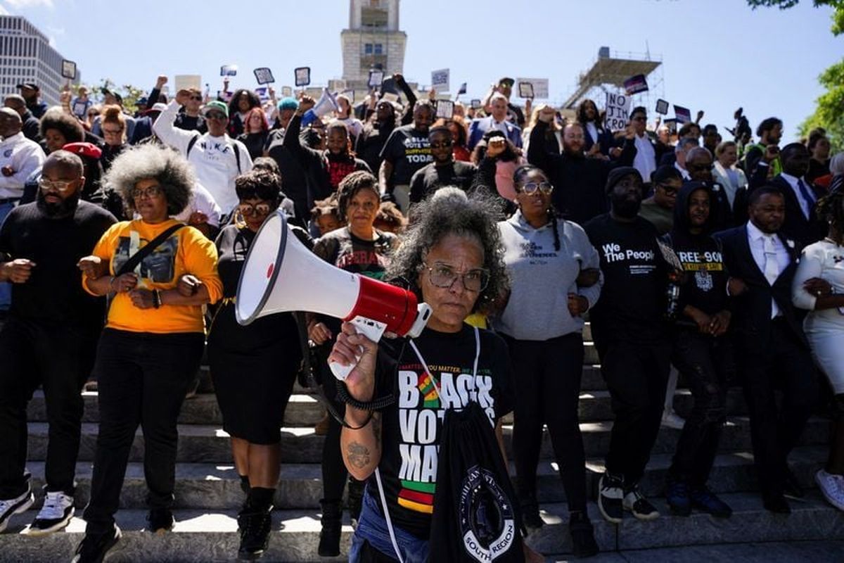 Demonstrators, including Democratic state House representatives and senators, walk down stairs outside the Tennessee state Capitol following passage of a new congressional map by the Republican majority on the final day of a special session, on Thursday, in Nashville.   (Reuters )