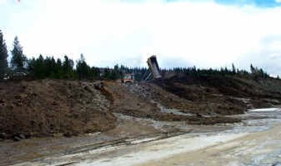 
This photo taken by an EPA inspector shows fill being dumped on a plateau above a large sediment basin as part of the Bellgrove to Mica reconstruction of U.S. Highway 95. The EPA and U.S. Department of Justice say the construction has violated the federal Clean Water Law.
 (Photo courtesy of the EPA / The Spokesman-Review)