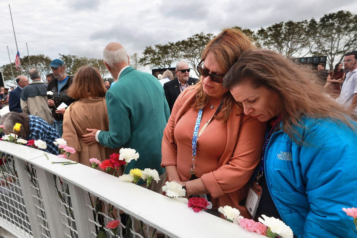Space Shuttle Columbia team members remember the loss of the STS-107 crew during NASA’s Day of Remembrance ceremony on Thursday at Kennedy Space Center Visitor Complex in Florida.  (Tribune News Service)