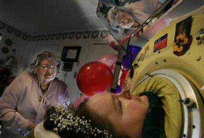 
Dianne Odell chats with her mother, Geneva Odell, via a mirror mounted above her iron lung at home in Jackson, Tenn., in 2007. Associated Press
 (Associated Press / The Spokesman-Review)