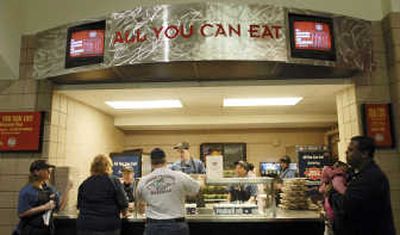 Customers wait at the Wachovia Center arena's All You Can Eat counter during the 76ers basketball game March 19 in Philadelphia. Associated Press
(Associated Press / The Spokesman-Review)