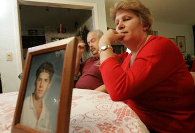
Michael and Mary Tresca sit at their dining room table behind a portrait of their son, Matthew, during an interview at their home in Clifton, N.J. Matthew was killed by a lightning strike while on a Boy Scout camping trip in 2002. 
 (Associated Press / The Spokesman-Review)