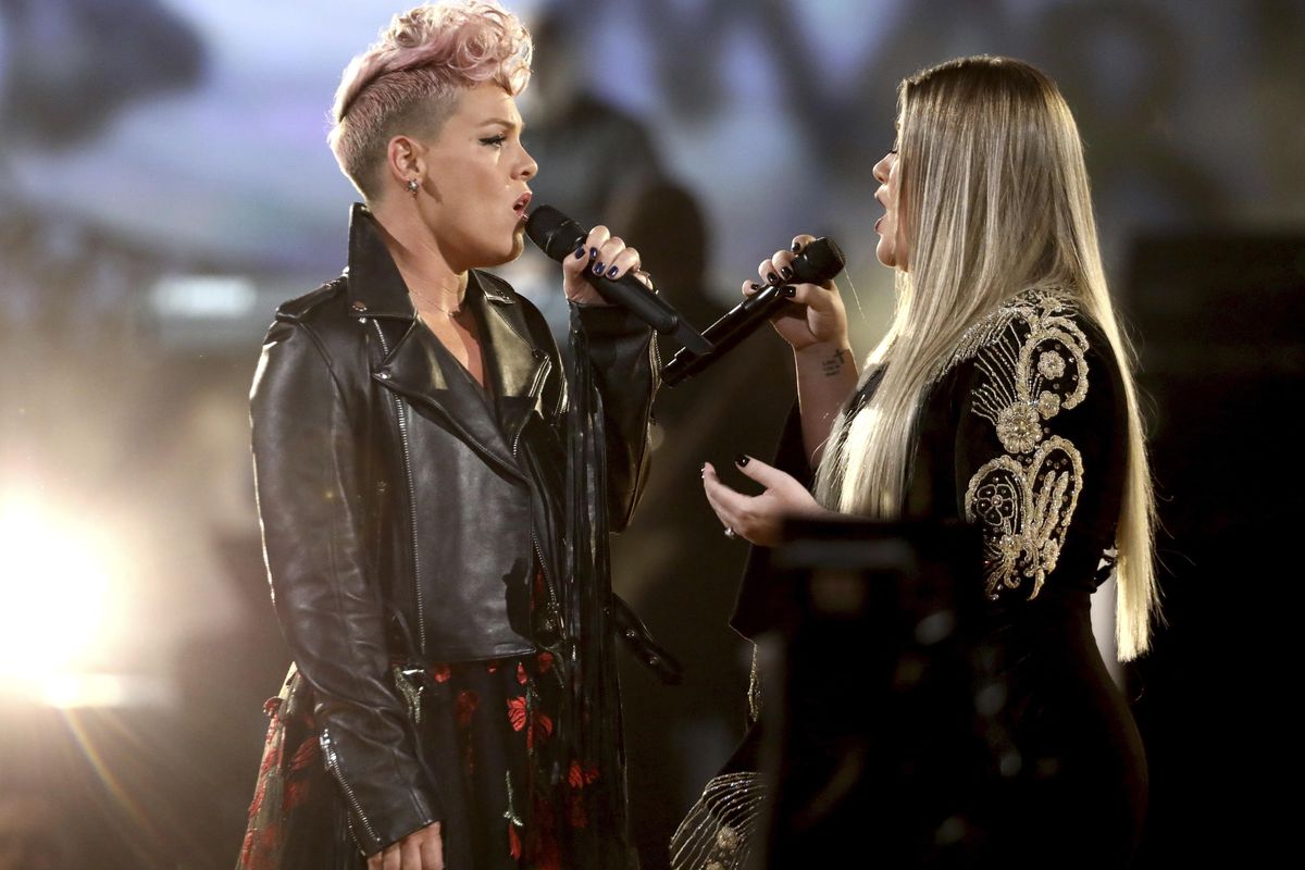 Pink, left, and Kelly Clarkson perform R.E.M.’s “Everybody Hurts” at the American Music Awards at the Microsoft Theater on Sunday, Nov. 19, 2017, in Los Angeles. (Matt Sayles / Invision/AP)
