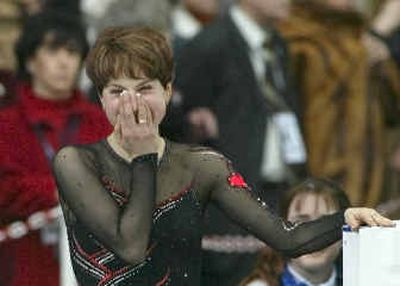 
Russias Irina Slutskaya reacts prior to the womens medal ceremony at the World Figure Skating Championships at Luzhniki Sports Palace in Moscow. 
 (Associated Press / The Spokesman-Review)