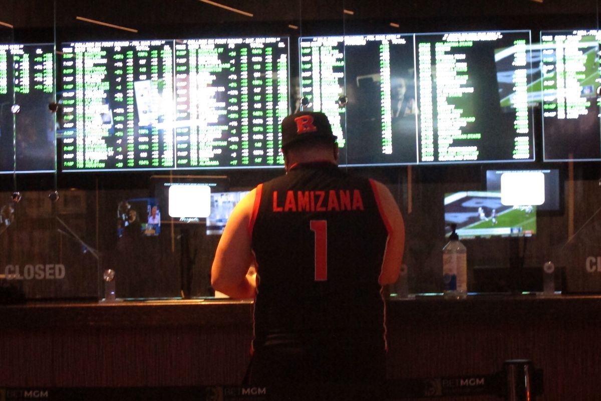 A man makes a sports bet at the Borgata casino in Atlantic City, N.J., on Friday, the first full day of the NCAA’s March Madness tournament.  (Wayne Parry)