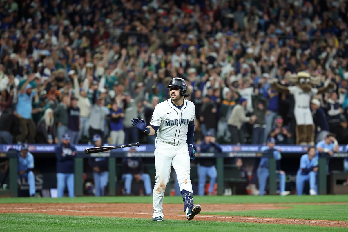 Seattle Mariners third baseman Eugenio Suárez reacts after hitting a go-ahead grand slam against the Toronto Blue Jays during the eighth inning in Game 5 of the ALCS on Friday at T-Mobile Park in Seattle. (Steph Chambers)
