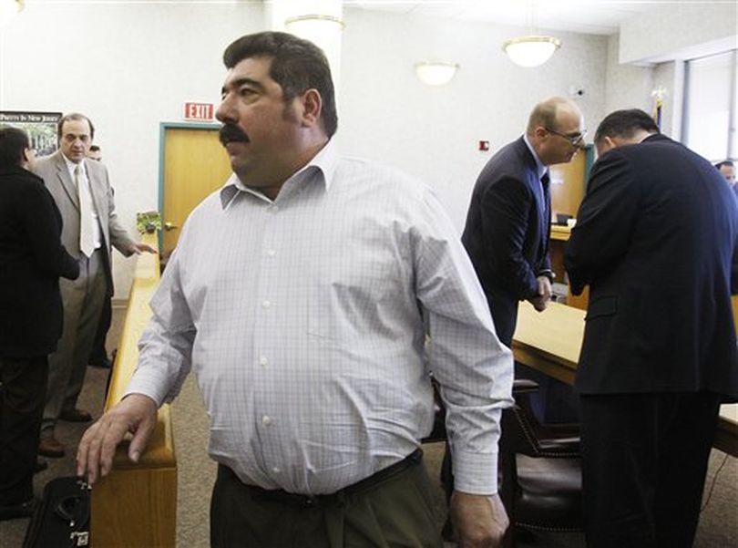 Americo Lopes exits the courtroom on Wednesday, March 14, 2012 in Elizabeth, N.J. A jury found that Lopes had cheated five co-workers out of their share of a $38.5 million lottery jackpot. The men worked at a construction company in Elizabeth and began a lottery pool in 2007. Americo Lopes claimed the winning numbers for the Nov. 10, 2009 jackpot were on a personal ticket and not the ticket that he had bought for the pool. The eight-member jury disagreed. (AP Photo/The Star-Ledger, Frances Micklow, Pool) ((AP Photo/The Star-Ledger, Frances Micklow, Pool))