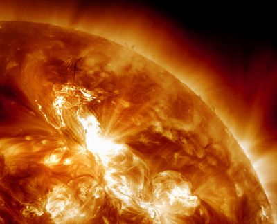 This image provided by NASA, taken Sunday night, shows a solar flare erupting on the sun’s northeastern hemisphere. (Associated Press)