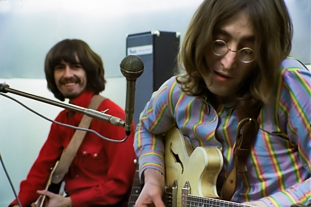 George Harrison and John Lennon at Apple Studios on Jan. 21, 1969. The Beatles exhibit at the Rock &Roll Hall of Fame in Cleveland features Lennon’s Epiphone Casino guitar and his glasses.  (Apple Corps)