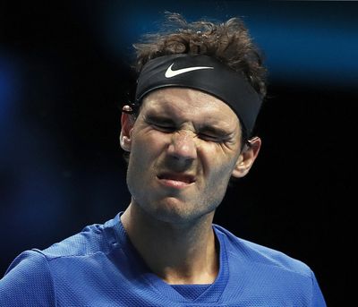 In this Nov. 13, 2017, file photo, Rafael Nadal of Spain grimaces during his singles tennis match against David Goffin of Belgium at the ATP World Finals at the O2 Arena in London. Nadal struggled with his timing and normally potent shot-making as he started his delayed preparations for the Australian Open with an error-filled 6-4, 7-5 loss to Richard Gasquet in the Kooyong Classic exhibition event Tuesday, Jan. 9, 2018. Nadal's readiness for the first Grand Slam of the year had been in doubt after the top-ranked Spaniard pulled out of an exhibition in Abu Dhabi and a tournament in Brisbane to start the season, citing his lack of preparation following an injury layoff at the end of 2017. (Kirsty Wigglesworth / Associated Press)