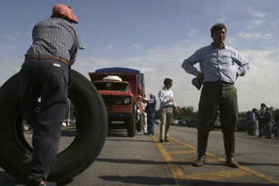 
Associated Press Farmers block a road in Tandil, Argentina, on Tuesday.  Argentina's biggest agricultural strike in decades is now entering its 13th day, with traffic jams reported throughout the vast farm belt.
 (Associated Press / The Spokesman-Review)