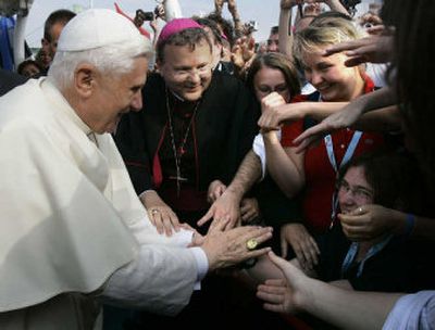 
Pope Benedict XVI is greeted by pilgrims and faithful upon his arrival on the boat RheinEnergie to cruise down the Rhine river near Cologne, Germany, on Thursday. 
 (Associated Press / The Spokesman-Review)