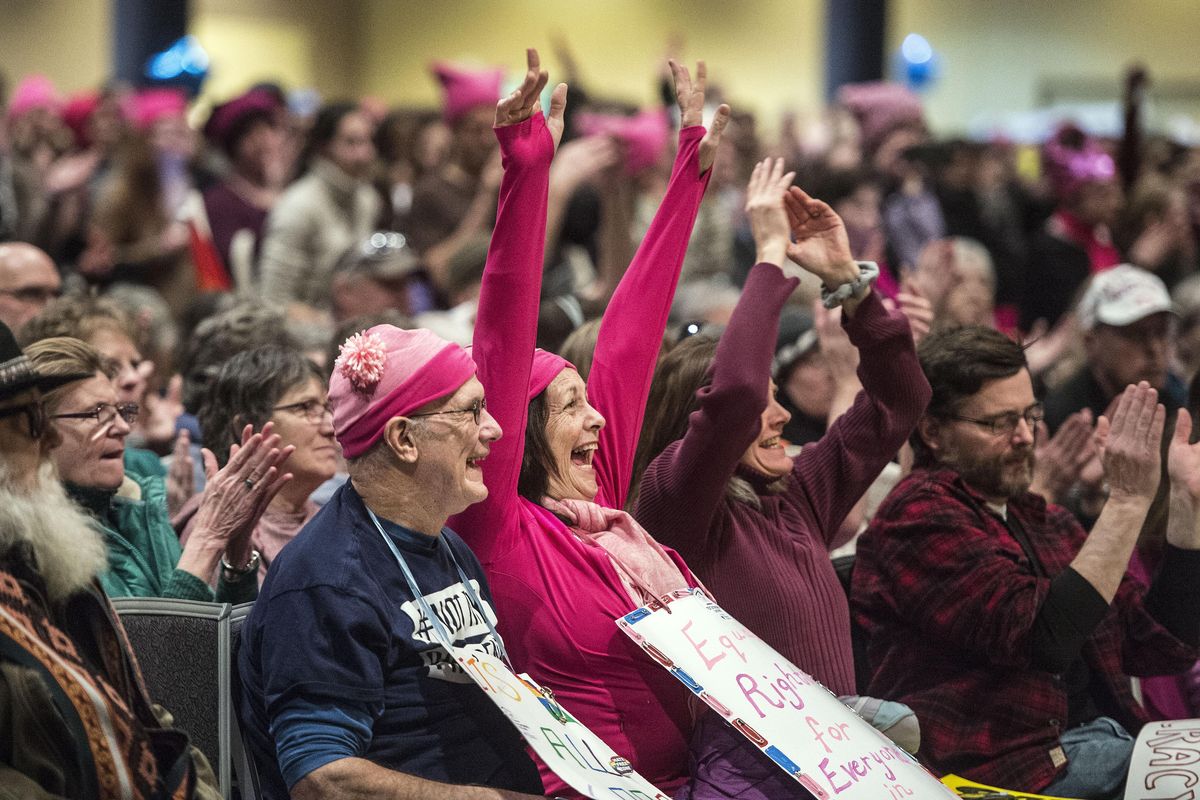 Cheers go up during the rally at the Spokane Convention Center for the Spokane/North Idaho Women’s March on Saturday, Jan. 21, 2017. (Dan Pelle / The Spokesman-Review)