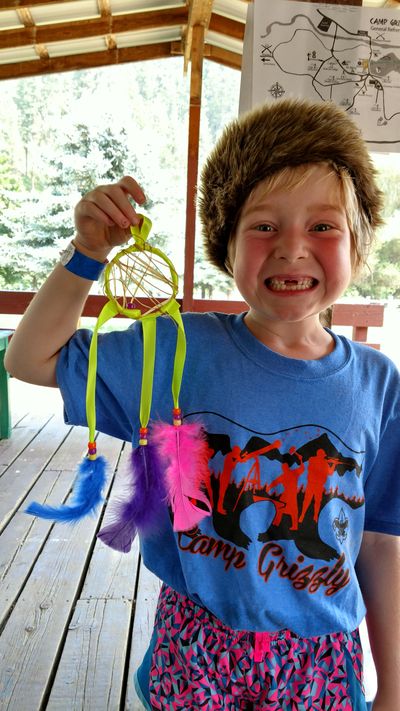 Kajsa Benson shows off the dream catcher she made at Cub Scouts Family Camp in August 2017 at Camp Grizzly, along the Palouse River. As of Monday, girls can join nearly 30 Cub Scout packs across the Inland Northwest, following a significant policy shift for the 108-year-old Boy Scouts of America. (Courtesy of Kate Benson, Boy Scouts Inland Northwest Council)