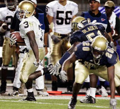 
Notre Dame's Darius Walker, left, busts past Pittsburgh's defense for a 51-yard TD. 
 (Associated Press / The Spokesman-Review)
