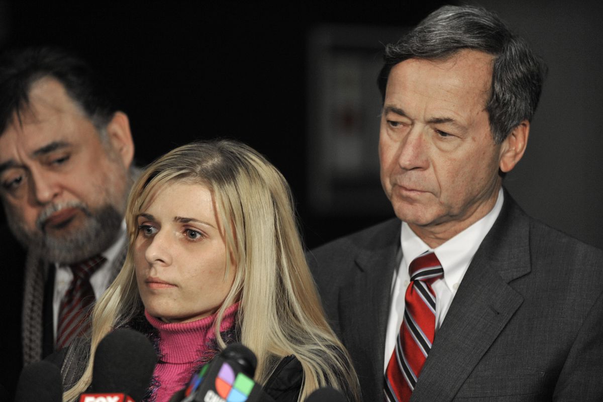 Bartender Karolina Obrycka, left, talks to the media while her attorney Terry Ekl, right, looks on during a news conference in Chicago on Tuesday, Nov. 13, 2012.  Jurors awarded $850,000 in damages to Obrycka, who was beaten in February 2007 by off-duty Chicago police officer Anthony Abbate, who was admittedly drunk at the time.  Surveillance video of the hulking Abbate pushing Obrycka to the ground behind the bar at Jesse