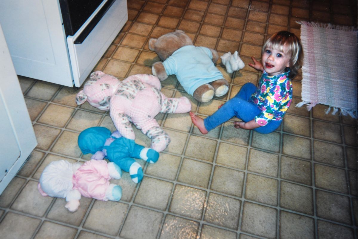 Kristina Nielsen, age 2 in 1994, turns over her stuffed animals for “adjustment.” (Dan Pelle / The Spokesman-Review)