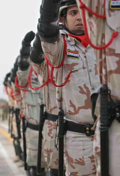 
Iraqi soldiers march Sunday during a hand-over ceremony in Basra. Associated Press
 (Associated Press / The Spokesman-Review)