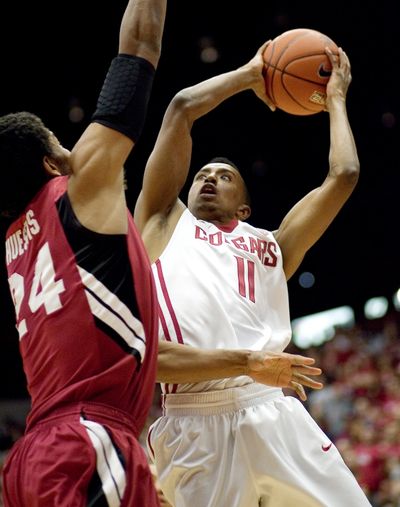 Washington State guard Faisal Aden (11) drives the baseline for a layup against Stanford forward Josh Huestis (24) during the first half of an NCAA college basketball game, Thursday, Jan. 19, 2012, in Pullman, Wash. (Dean Hare / Fr158448 Ap)