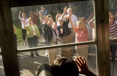 
Teachers and administrators at Sheridan Elementary greet new students from other area elementary schools Friday in Spokane during a practice bus run. Students from three schools under construction are being hosted by the district's other schools. 
 (Brian Plonka / The Spokesman-Review)