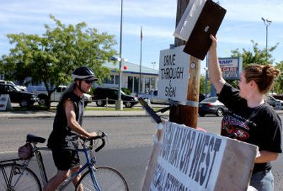 
Tim Ricks stops to sign the petition to recall Spokane Mayor Jim West, on Tuesday at the official petition headquarters. 
 (Kathryn Stevens / The Spokesman-Review)