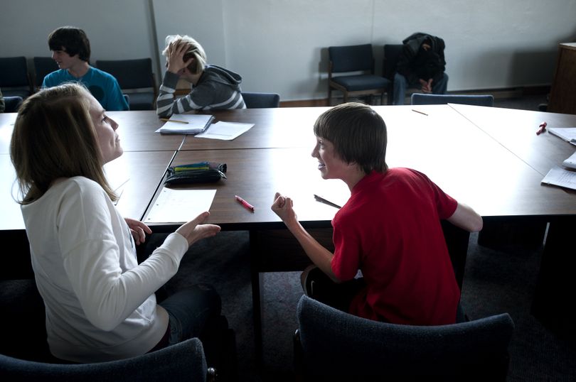 John Rice, 15, acts out an improvisation scene with Tori Heischel during a creative writing exercise designed to show how characters influence story on Tuesday at RiverCity Leadership Academy in the West Valley School District. RiverCity will close at the end of the school year. (Tyler Tjomsland)