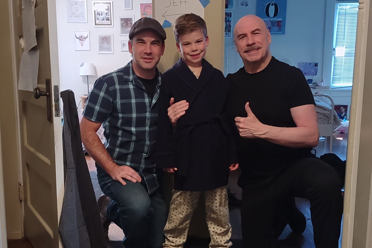 Dalton Shotwell, Clark Shotwell and actor and director John Travolta pose on the set of Travolta’s film, “Propeller One-Way Night Coach.”  (Courtesy)