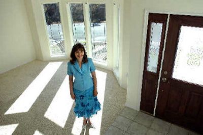 
Realtor Natalia Seefeldt stands in a home for sale. Seefeldt caters to the Russian-speaking community of Spokane. 
 (Holly Pickett / The Spokesman-Review)