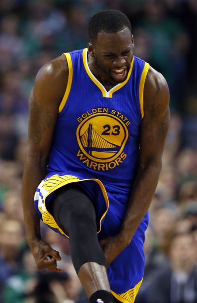 Golden State’s Draymond Green reacts after making a 3-point basket that helped erase a 26-point deficit against Boston. (Associated Press)